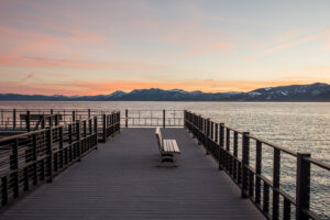 Bench on a Lake Tahoe pier at sunset as a landscape