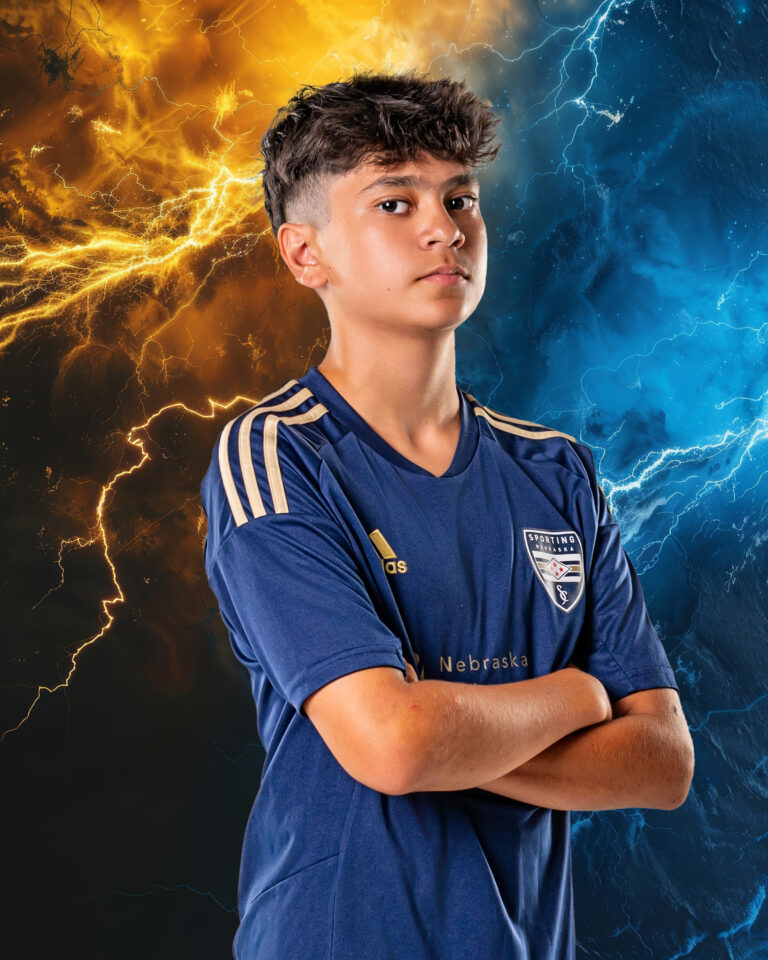 Dual color background with lightning behind soccer player